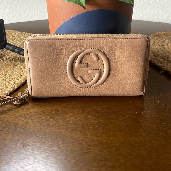 Gucci Handbags - Authentic GUCCI Tan Interlocking G Tassel Leather Zip Around Long Wallet